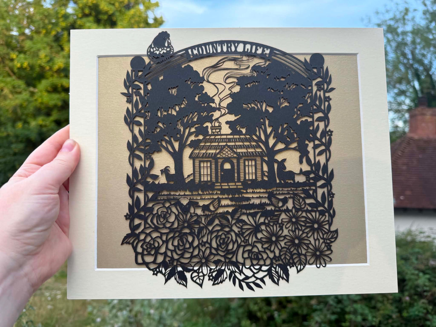 “A country life” intricate papercut.